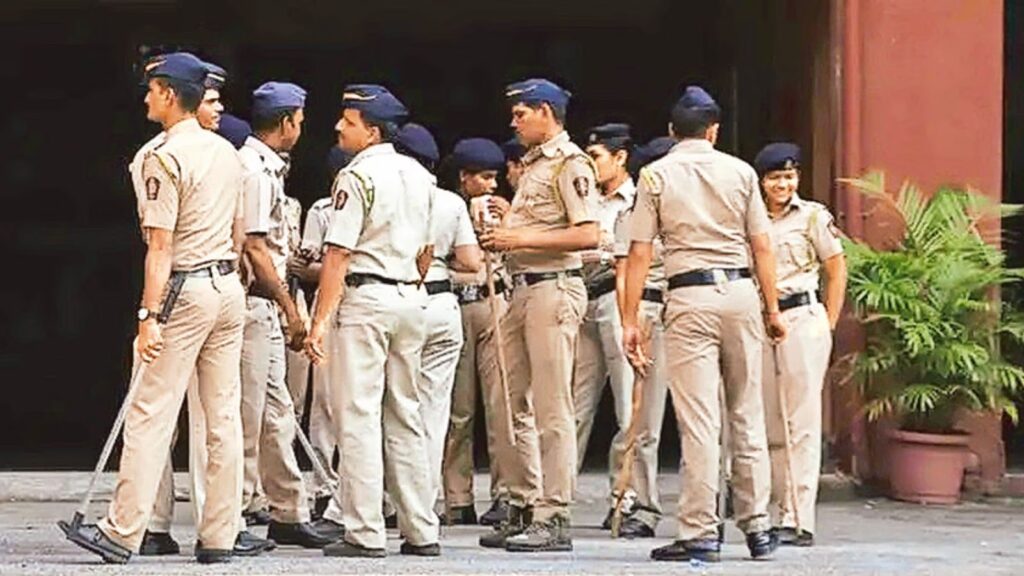 Uttar Pradesh police personnel gathered during official duty at a public building